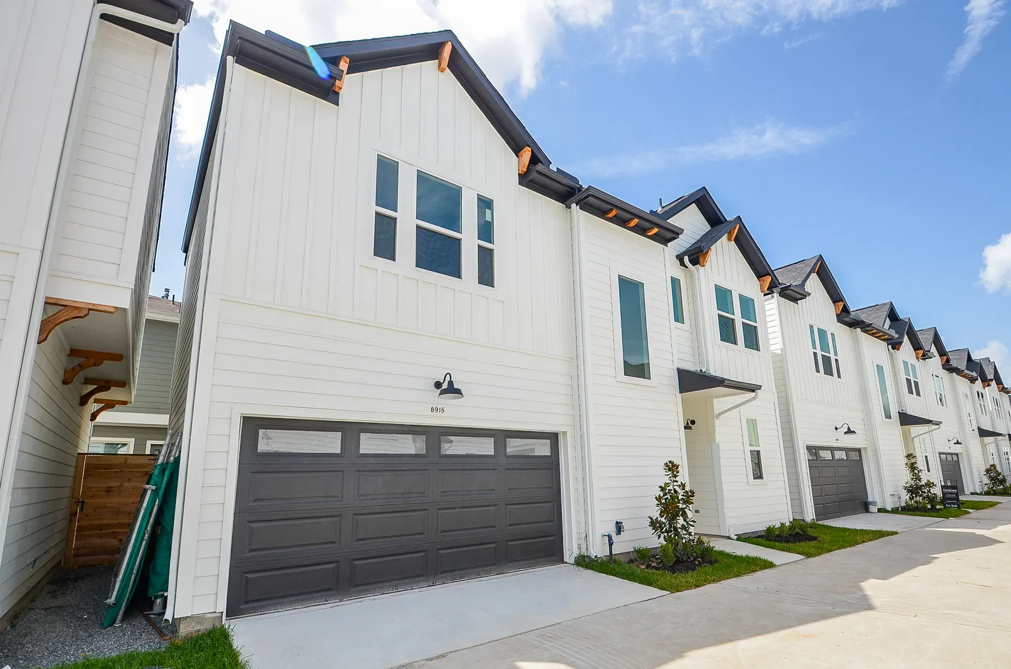 White gabled townhomes at Knoll Oak Villas in Spring Branch